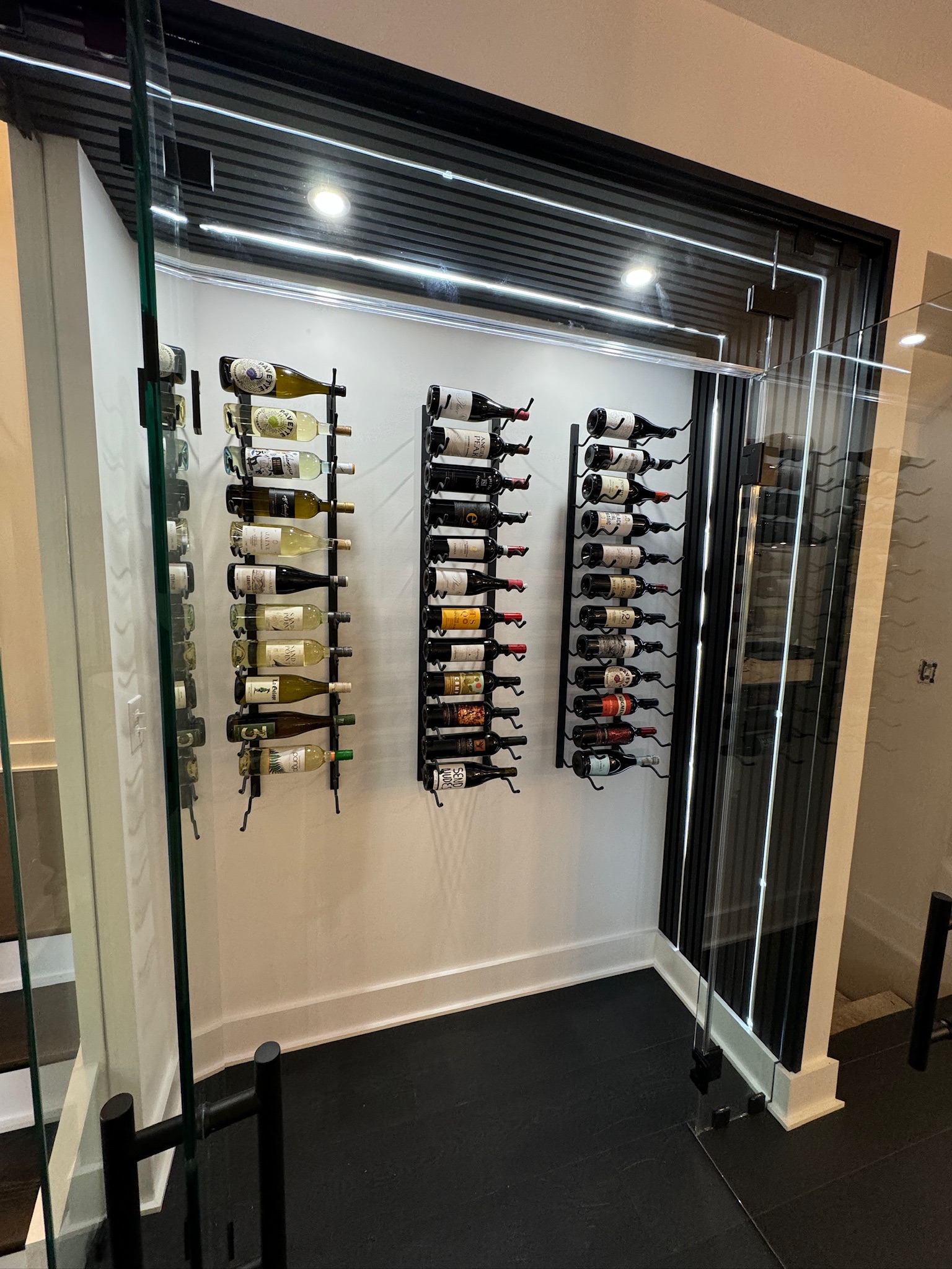 Finished custom wine cellar build-out by Primo Construction Pro